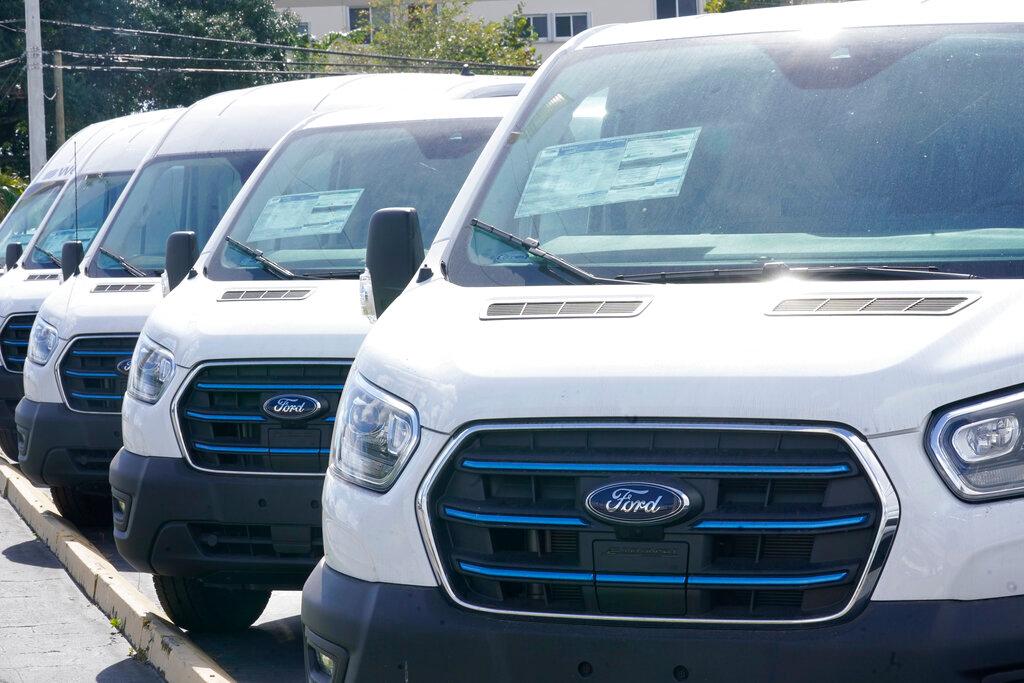 Ford E-Transit electric vans are displayed at a Gus Machado Ford dealership