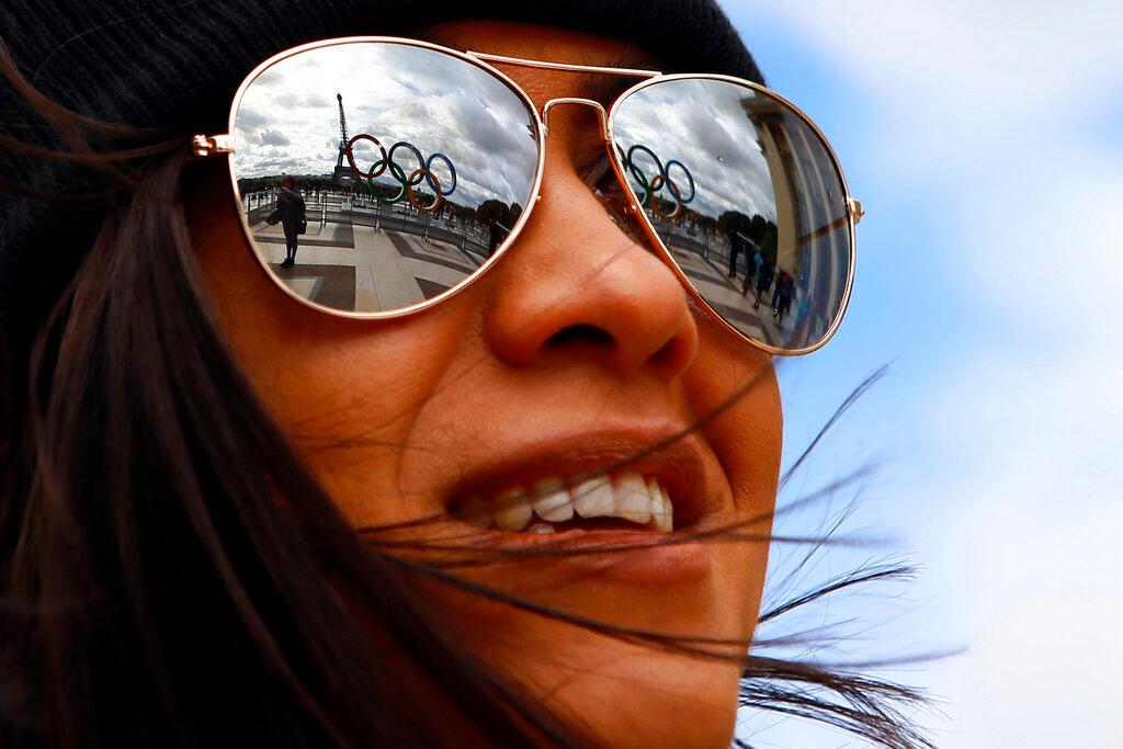 The Olympic rings are reflected on sunglasses, on Trocadero plaza that overlooks the Eiffel Tower, a day after the official announcement that the 2024 Summer Olympic Games will be in the French capital, in Paris, Sept. 14, 2017.