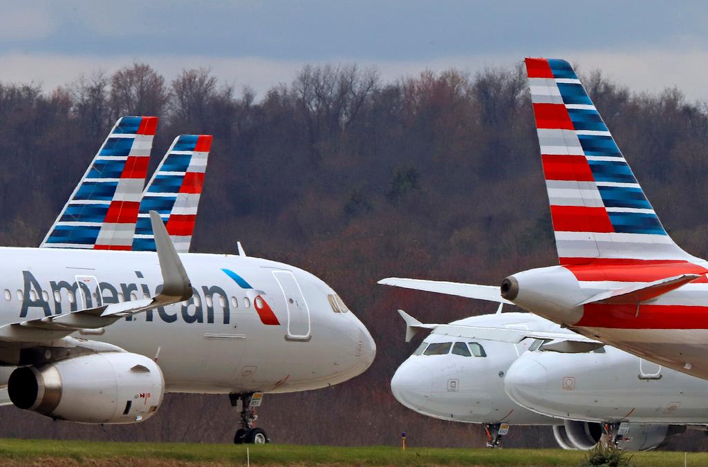 American Airlines planes sit stored at Pittsburgh International Airport on March 31, 2020, in Imperial, Pa.