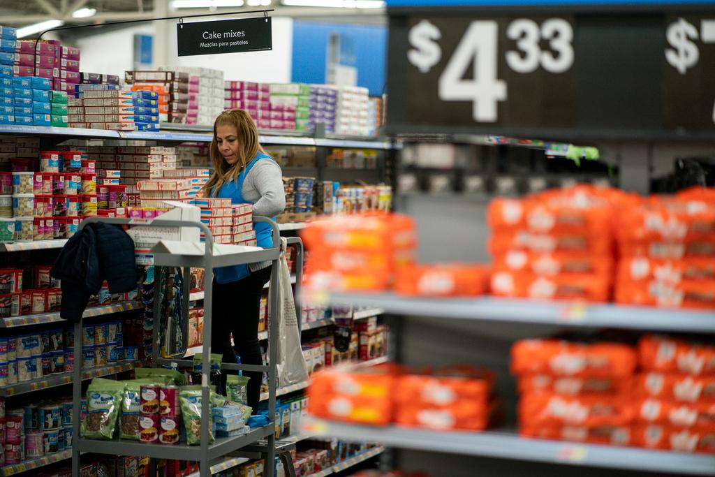 A worker organizes items at a Walmart Supercenter