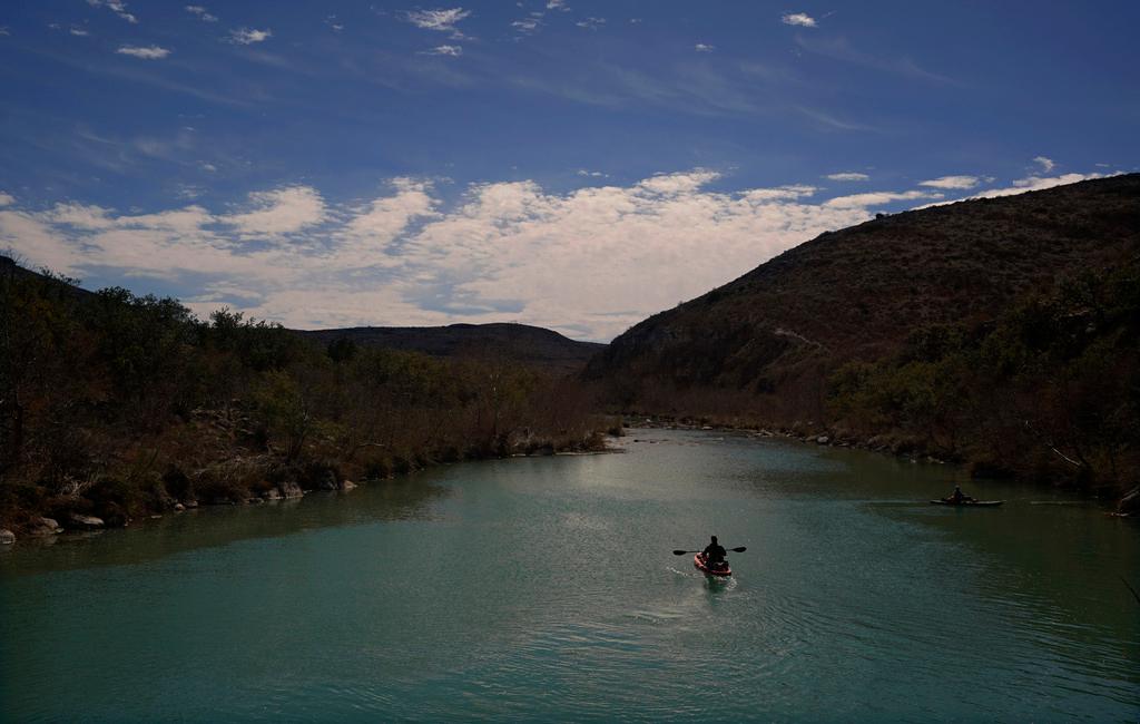 A paddler floats along the Devil's River near Del Rio, Texas