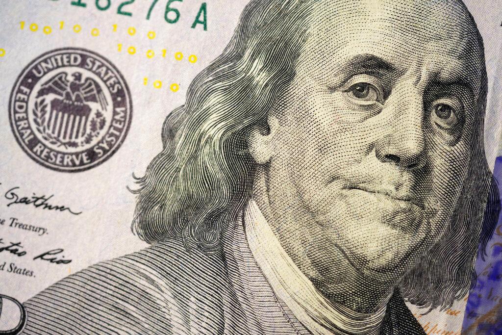 The likeness of Benjamin Franklin is seen on a U.S. $100 bill.