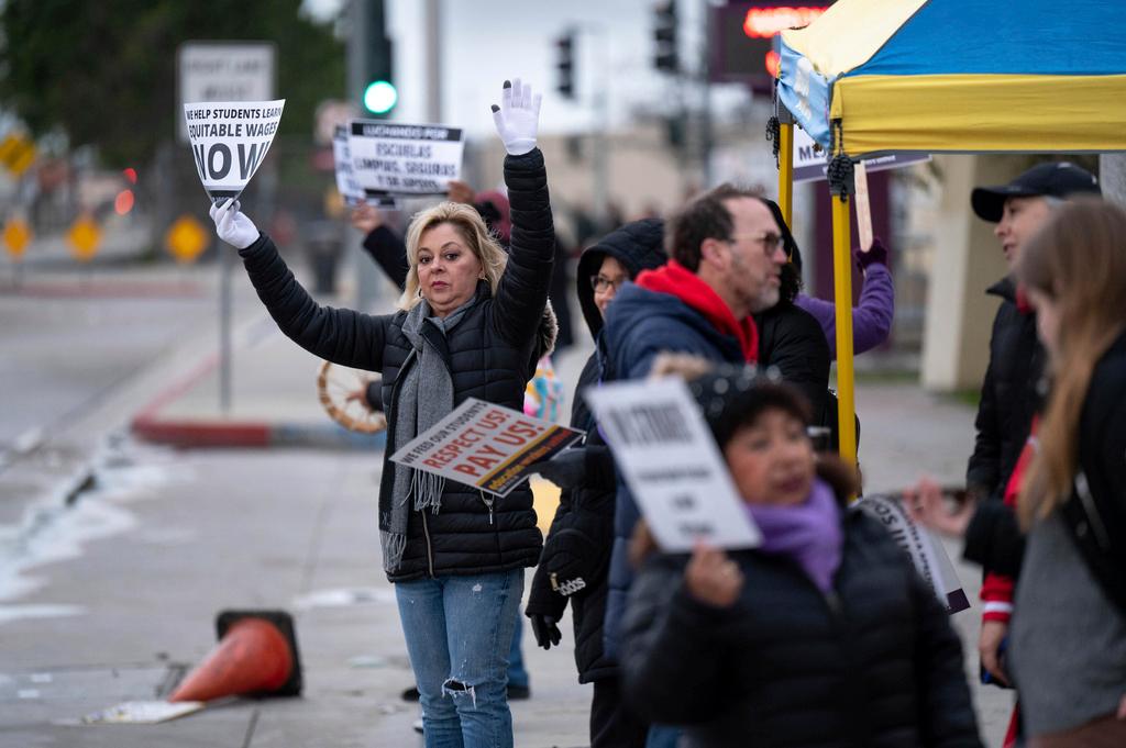 SEIU workers, teachers and supporters picket outside Cesar Chavez Learning Academy in San Fernando, Calif.