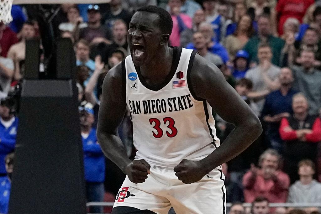 San Diego State forward Aguek Arop (33) celebrates victory against Creighton in the second half of a Elite 8 college basketball game in the South Regional of the NCAA Tournament