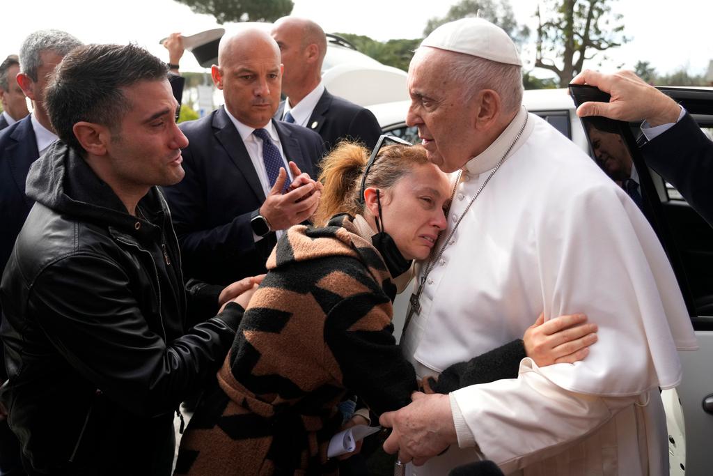 Pope Francis consoles Serena Subania and Matteo Rugghia, left, who lost their 5-year-old daughter Angelica
