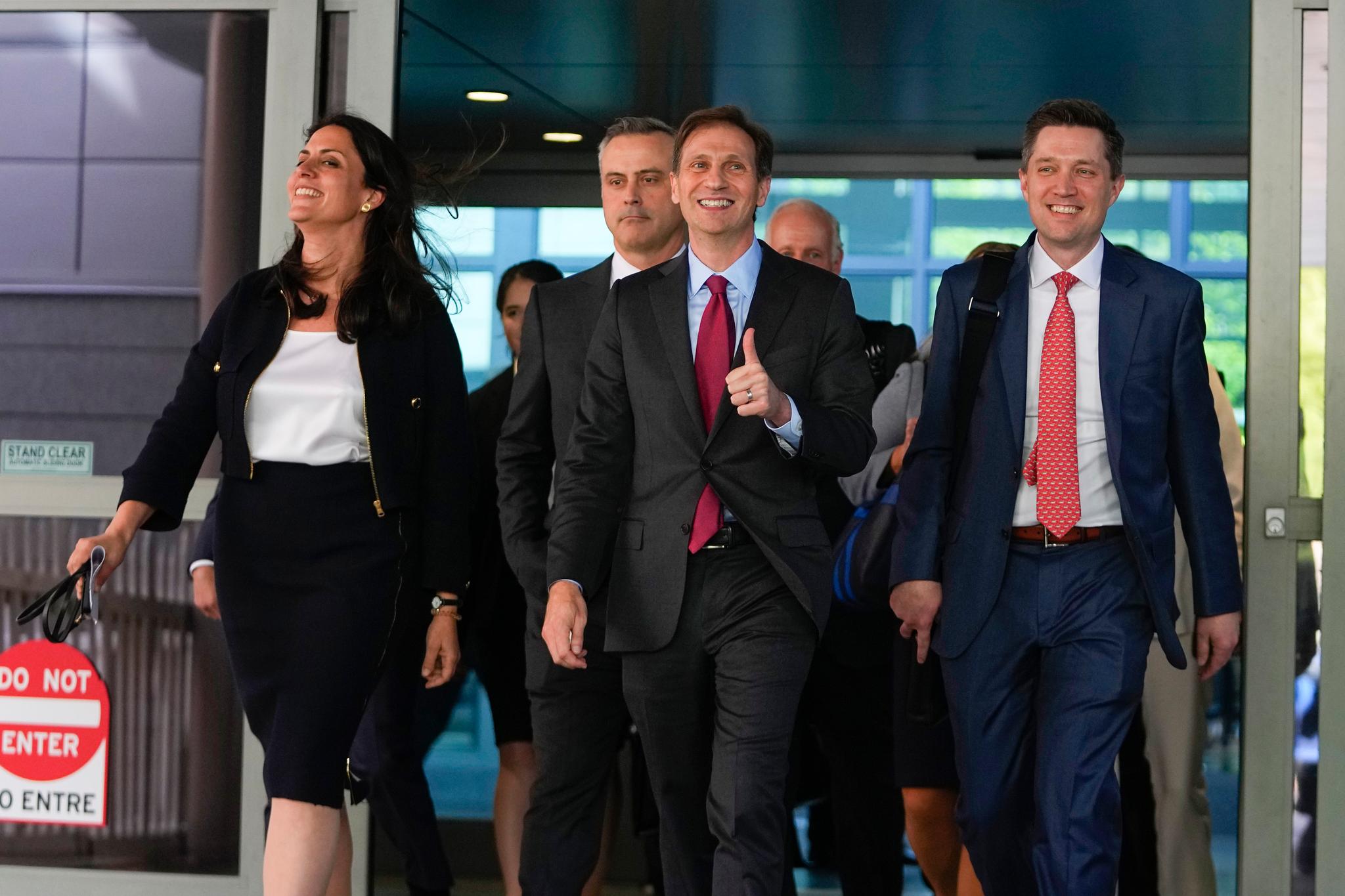 Davida Brook, left, Justin Nelson, center, and Stephen Shackelford, right, attorneys for Dominion Voting Systems, exit the New Castle County Courthouse in Wilmington, Del., after the defamation lawsuit by Dominion Voting Systems against Fox News was settled just as the jury trial was set to begin, Tuesday, April 18, 2023.