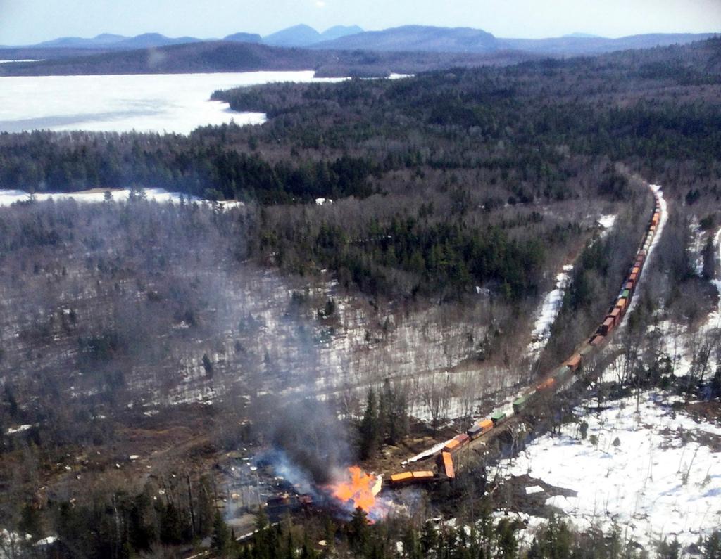 This photo provided by the Maine Forest Service shows several locomotives and rail cars burning after a freight train derailed, Saturday, April 15, 2023