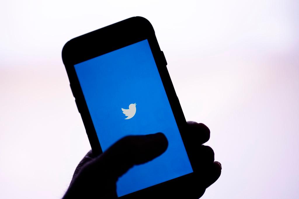 The Twitter application is seen on a digital device, April 25, 2022, in San Diego. 