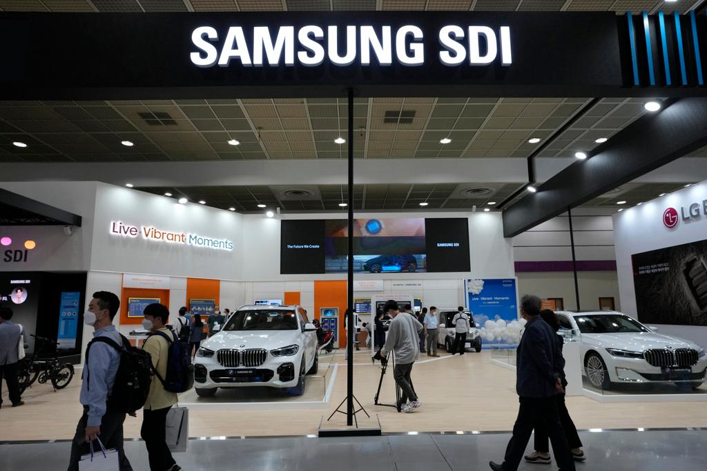 People walk by Samsung SDI Co.' booth during the InterBattery 2021, the country's leading battery exhibition, at COEX in Seoul, South Korea