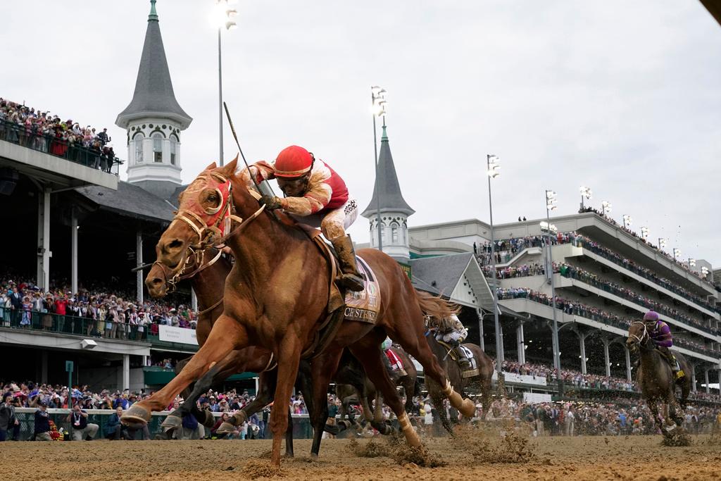 Rich Strike, with Sonny Leon aboard, crosses the finish line to win the 148th running of the Kentucky Derby horse race at Churchill Downs Saturday, May 7, 2022, in Louisville, Ky. Rich Strike's stunning upset victory in last year's Kentucky Derby as a nearly 81-1 long shot provided the race's second biggest odds winner in four years. 