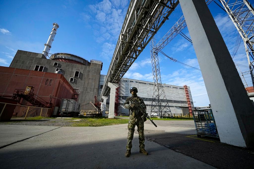 A Russian serviceman guards in an area of the Zaporizhzhia Nuclear Power Station in territory under Russian military control, southeastern Ukraine, May 1, 2022.