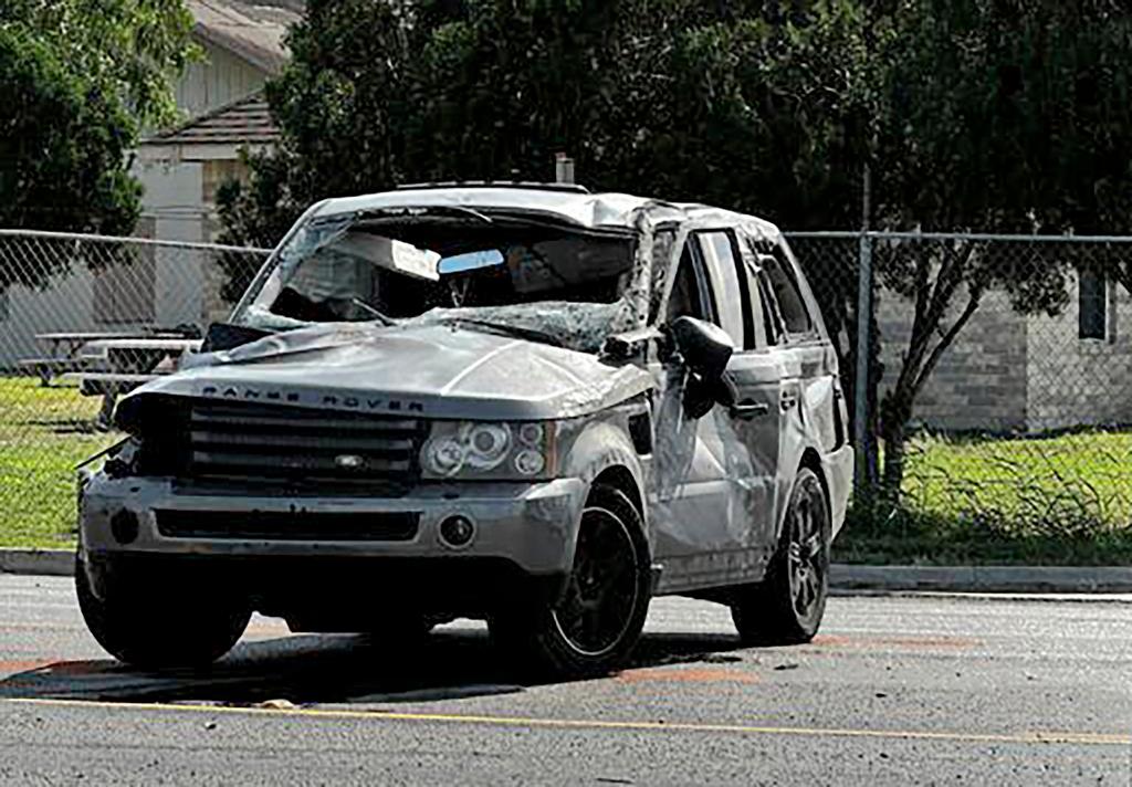 A damaged vehicle sits at the site of a deadly collision near a bus stop in Brownsville, Texas, on Sunday, May 7, 2023. 