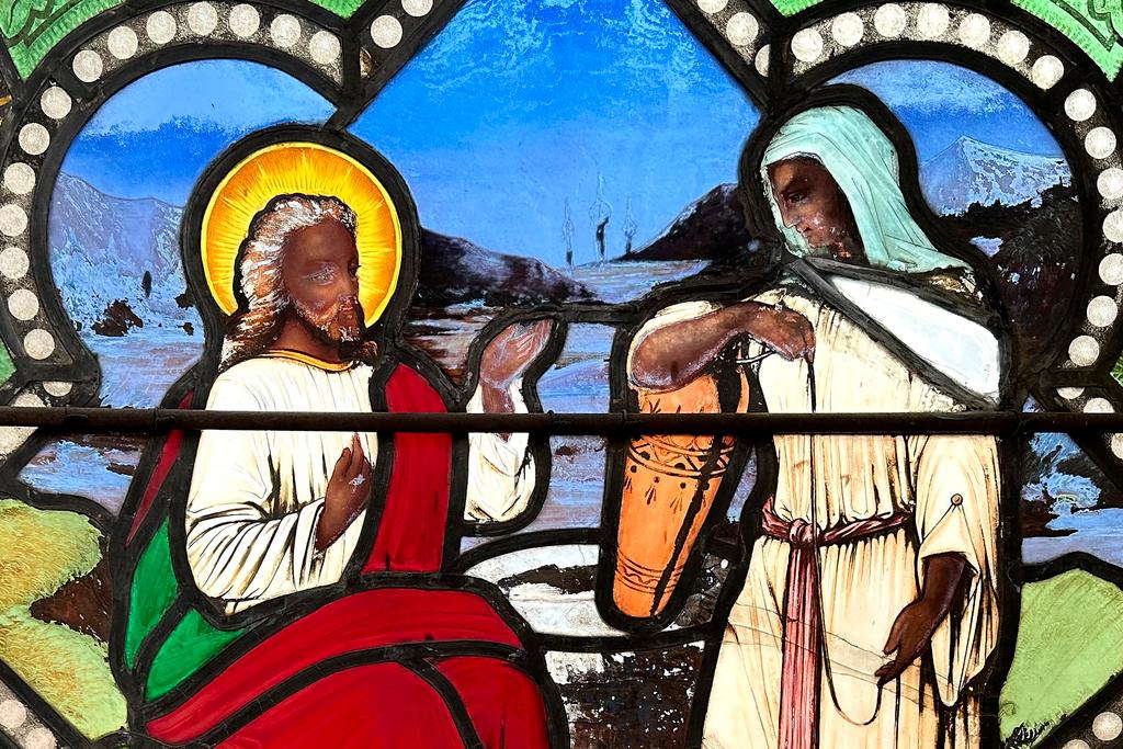 A nearly 150-year-old stained-glass window depicts Christ speaking to a Samaritan woman, in the now-closed St. Mark's Episcopal church in Warren, R.I. 