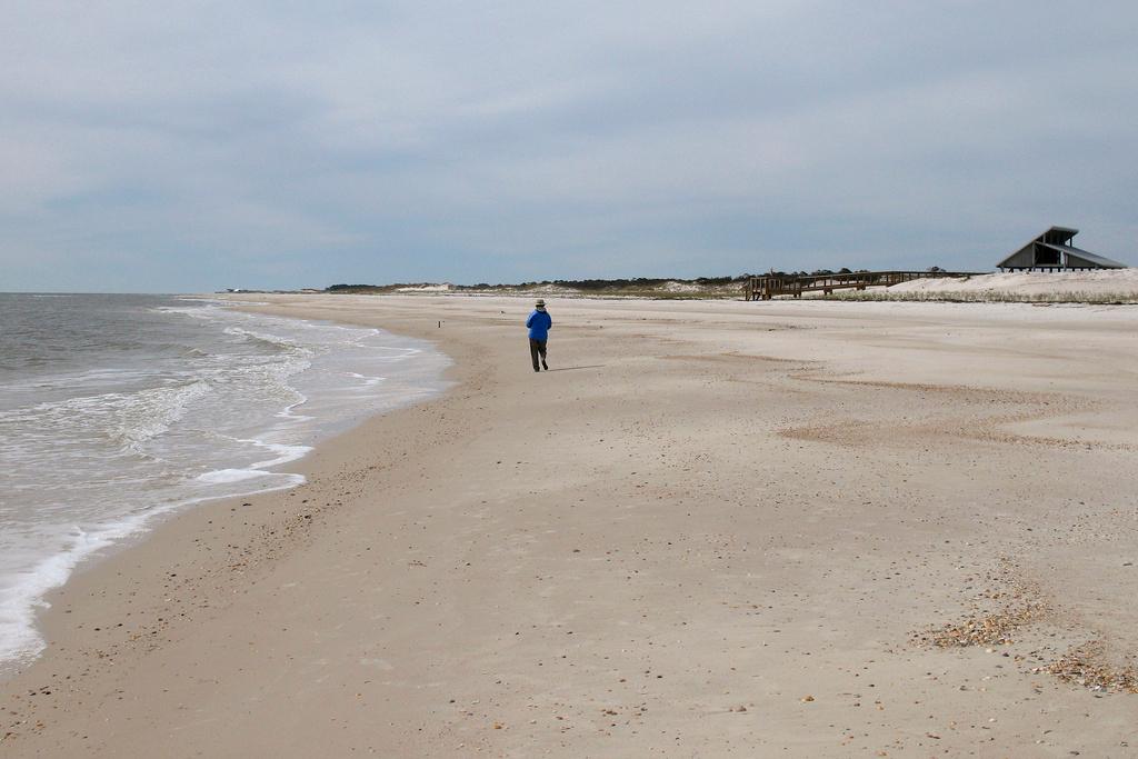 Miles of empty beach and billions of sea shells await a lone beachcomber at St. George Island State Park near Apalachicola in the Florida Panhandle