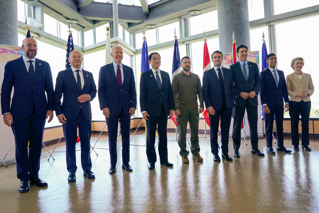President Joe Biden, third from left, and Ukrainian President Volodymyr Zelenskyy, center, and other G7 leaders pose for a photo before a working session on Ukraine during the G7 Summit in Hiroshima, Japan