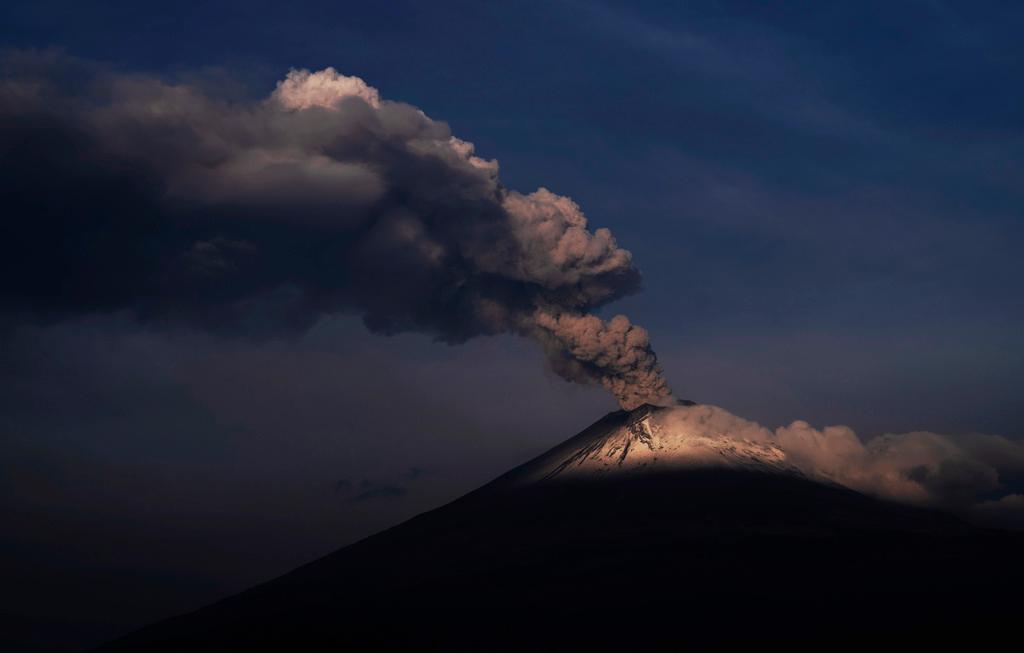 The Popocatepetl volcano spews ash and steam, seen from Santiago Xalitzintla, Mexico