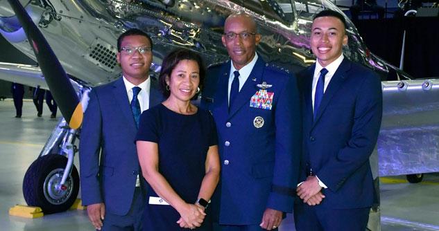 General Brown, Jr. and his wife and two sons, all in blue