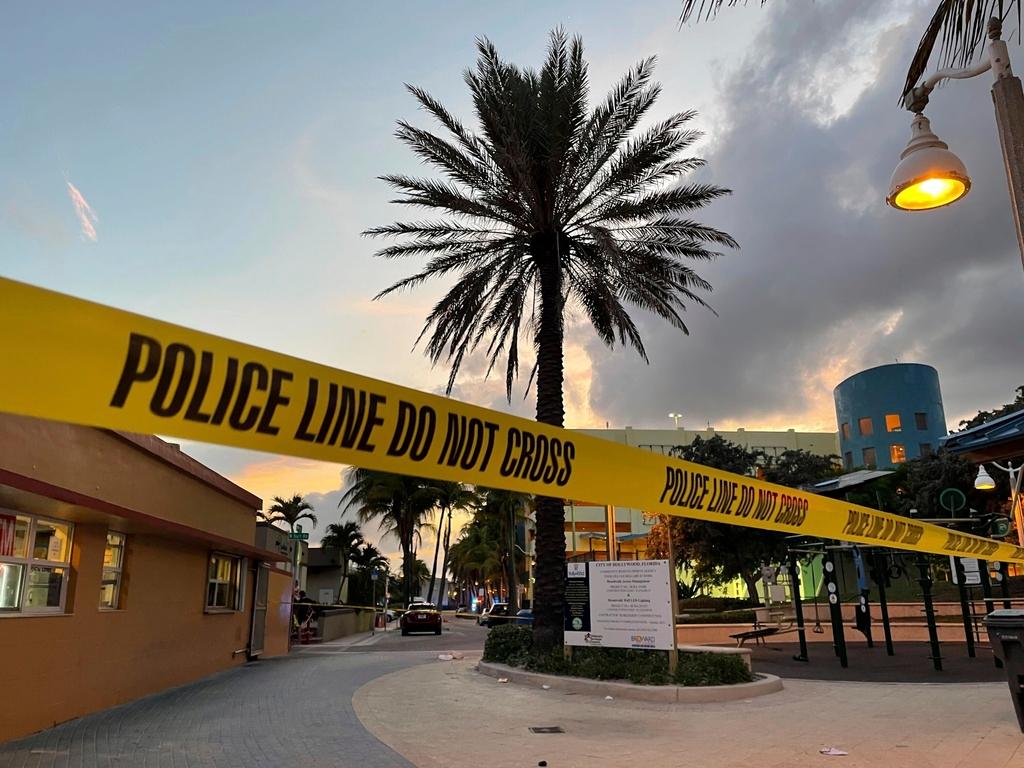 Police cordon off an area as they respond to a shooting near the Hollywood Beach Broadwalk in Hollywood, Fla.