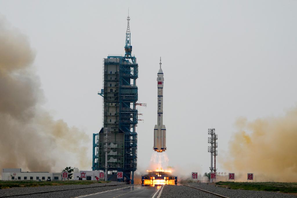A Long March rocket carrying a crew of Chinese astronauts in a Shenzhou-16 spaceship lifts off at the Jiuquan Satellite Launch Center in northwestern China