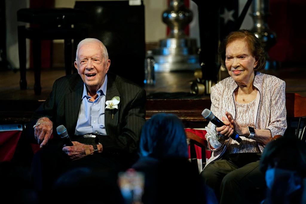  Former President Jimmy Carter and his wife former first lady Rosalynn Carter sit together during a reception to celebrate their 75th wedding anniversary on July 10, 2021