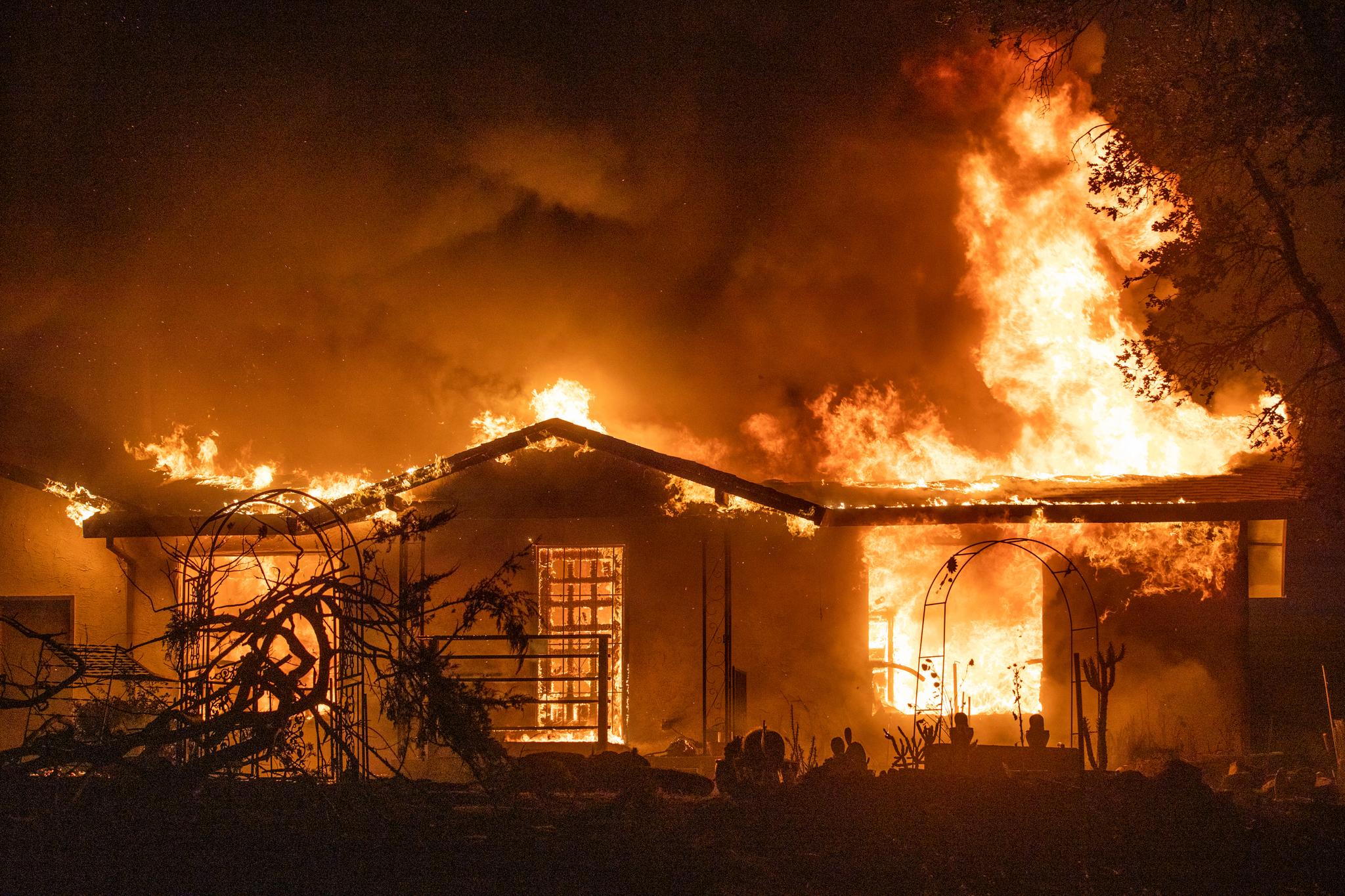 A house burns on Platina Road at the Zogg Fire near Ono, Calif., on Sept. 27, 2020.
