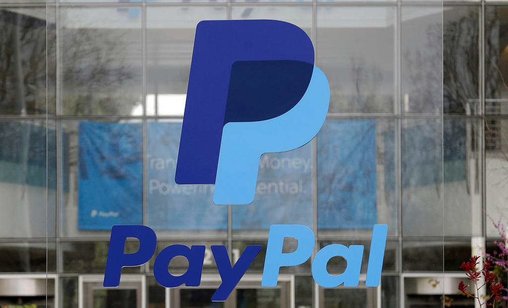 The PayPal logo hangs displayed outside their company headquarters on March 10, 2015