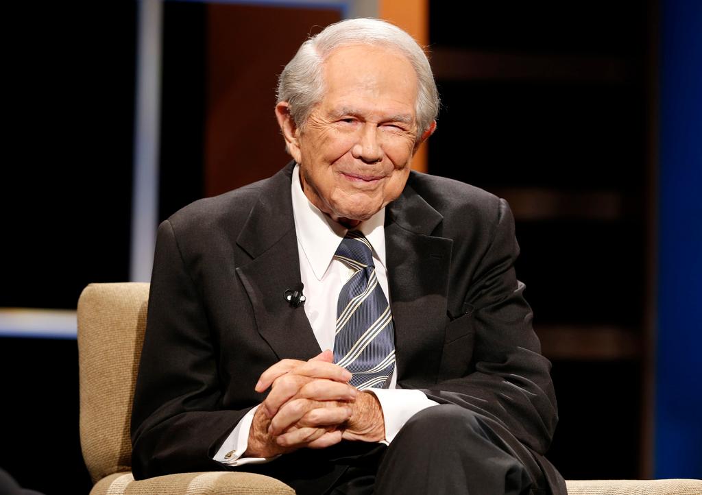 Rev. Pat Robertson poses a question to a Republican presidential candidate during a forum at Regent University in Virginia Beach, Va., Oct. 23, 2015.
