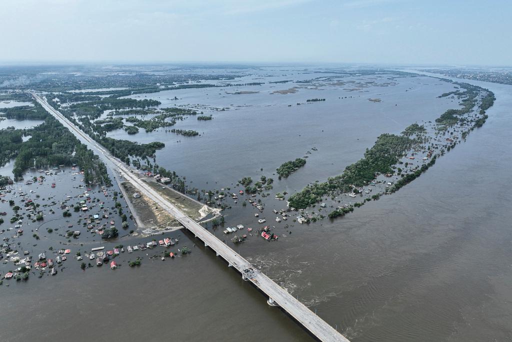 Houses are seen underwater in the flooded village near Kherson, Ukraine, Saturday, June 10, 2023. The destruction of the Kakhovka Dam in southern Ukraine is swiftly evolving into long-term environmental catastrophe. It affects drinking water, food supplies and ecosystems reaching into the Black Sea. 