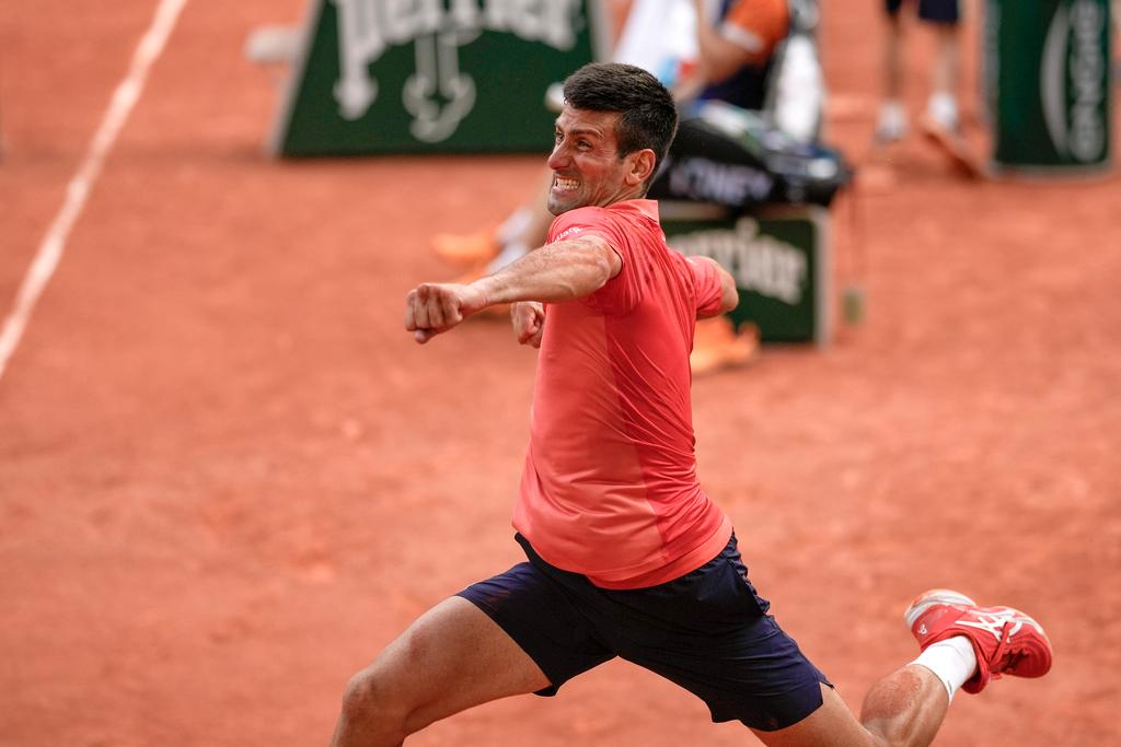 Serbia's Novak Djokovic celebrates winning the men's singles final match of the French Open tennis tournament against Norway's Casper Ruud