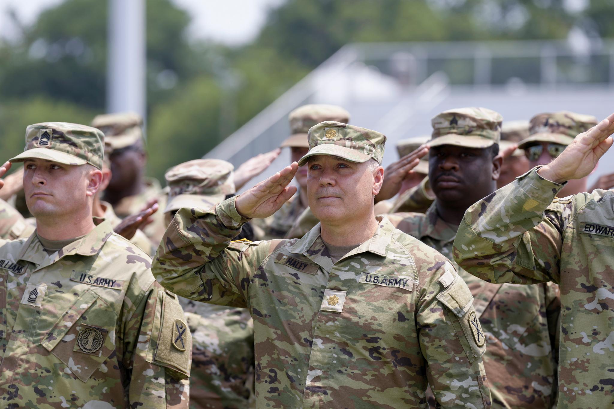 Maj. Michael Haley stands at attention during a deployment ceremony for his South Carolina National Guard unit on Saturday, June 17, 2023, in Charleston, S.C.