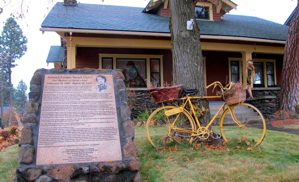 A sign stands on Nov. 21, 2014, outside the home where Sonora Smart Dodd lived in Spokane, Wash., in the early 20th century. The sign commemorates Dodd as the person who conceived the idea of Father's Day in 1909