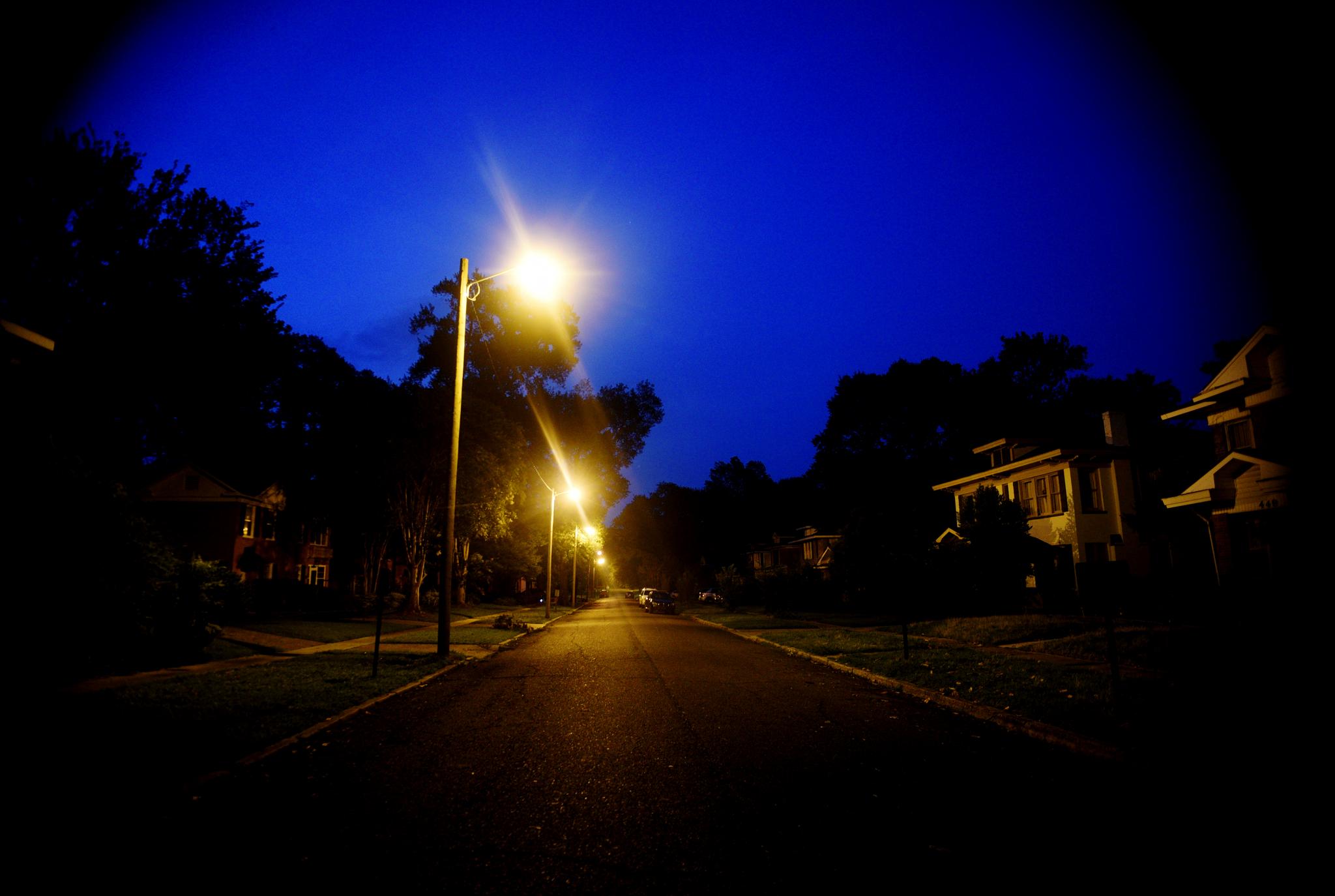 Forrest Avenue, in the South Highland neighborhood, is dark except for streetlights in the early hours of Saturday, June 17, 2023, following a storm, in Shreveport, La.