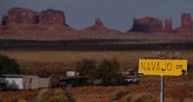 Oljato-Monument Valley, Utah in the background, yellow Navajo Dr. sign in the foreground