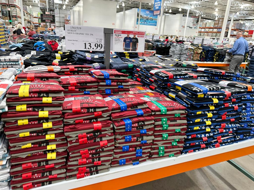 table with clothes for sale