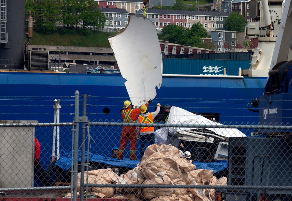 Debris from the Titan submersible recovered from ocean floor unloaded from the ship Horizon Arctic at the Canadian Coast Guard pier in St. John's, Newfoundland