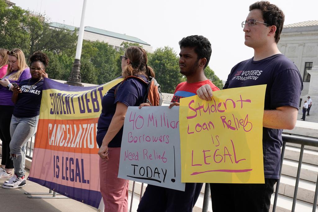 People in favor of canceling student debt protest outside the Supreme Court