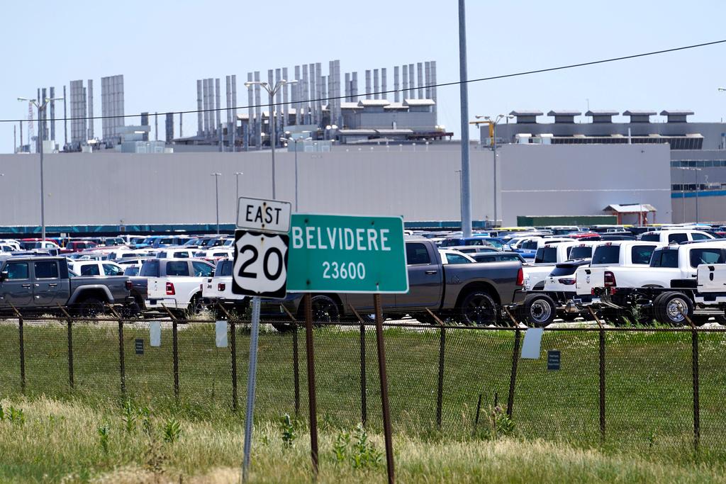 New vehicles sit in a parking lot waiting for transport at the former Fiat Chrysler Auto Plant, now owned by Stellantis