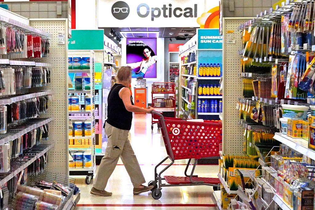 A shopper looks down an aisle in a Target store