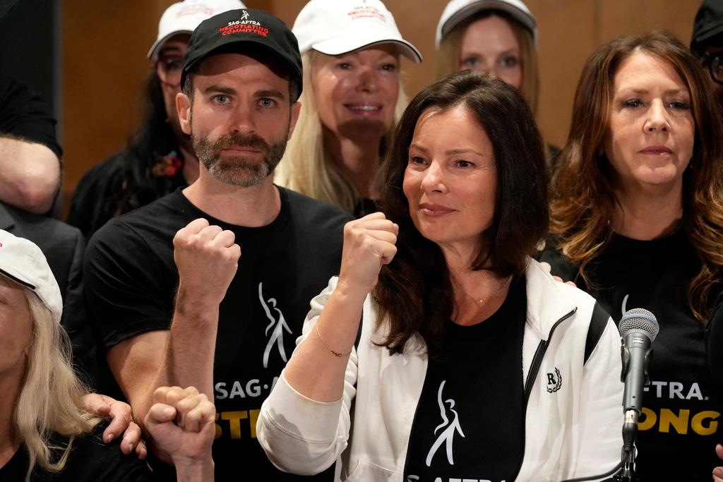 SAG-AFTRA president Fran Drescher, center, Ben Whitehair, left, and Joely Fisher attend a press conference announcing a strike by The Screen Actors Guild-American Federation of Television and Radio Artists on Thursday, July, 13, 2023, in Los Angeles.