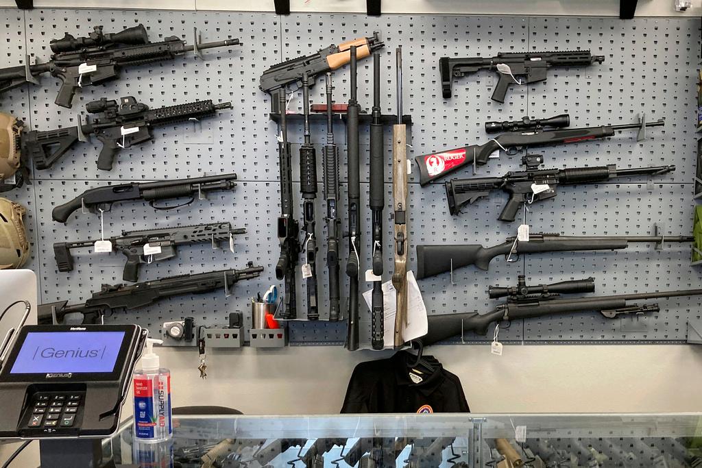 Firearms are displayed at a gun shop in Salem, Ore.