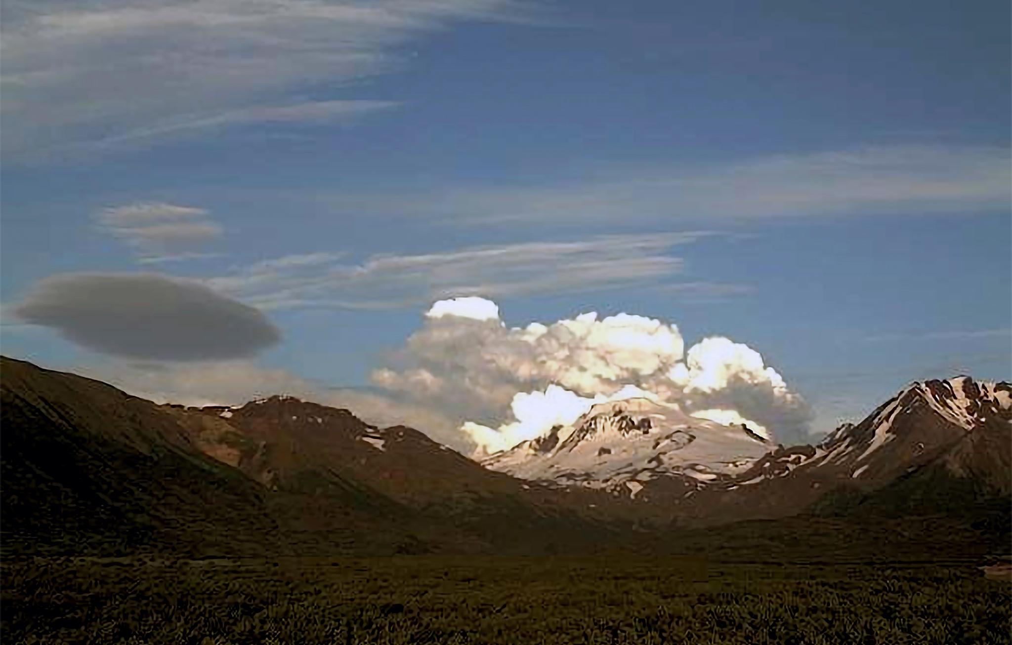 This web camera image provided by the U.S. Geological Survey shows a low-level ash plume from the Shishaldin Volcano captured on Tuesday, July 18, 2023.