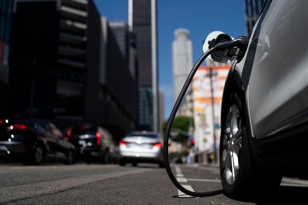 An electric vehicle is plugged into a charger in Los Angeles