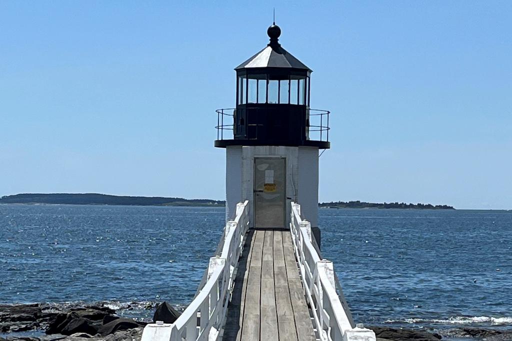 The Marshall Point lighthouse sits on the water's edge