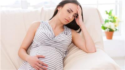 pregnant lady holding head