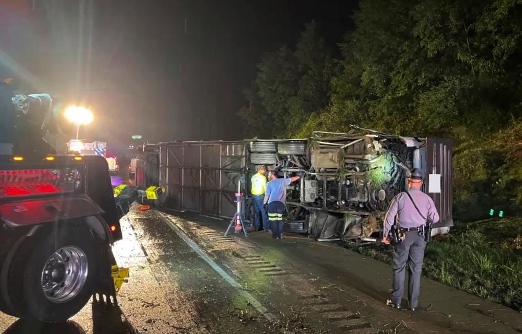 Police and rescue workers arrive on the scene of a bus crash late Sunday, Aug. 6, 2023, in Lower Paxton Township, Dauphin County ,Pa. 