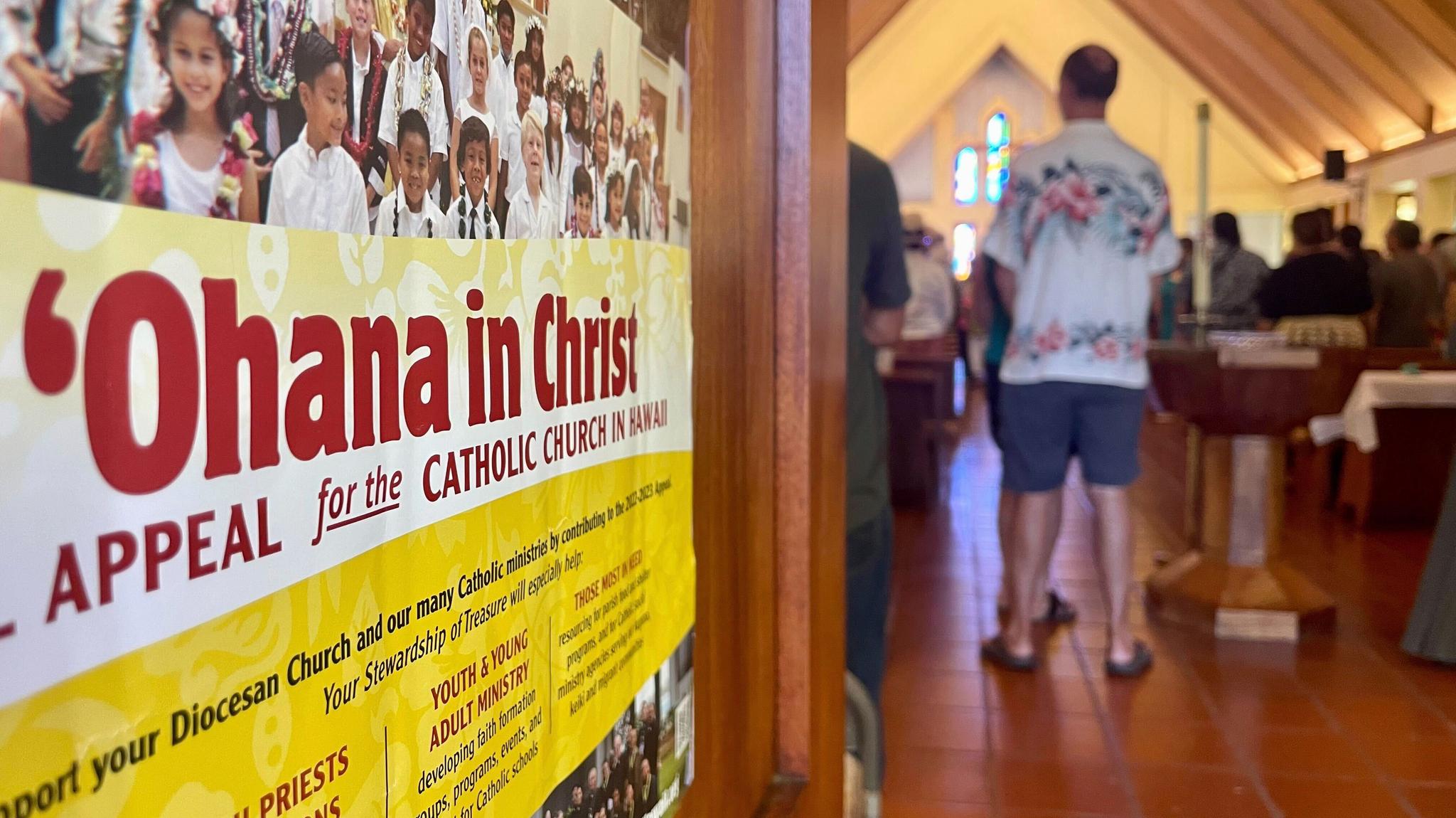 "Ohana in Christ' sign with people at a church