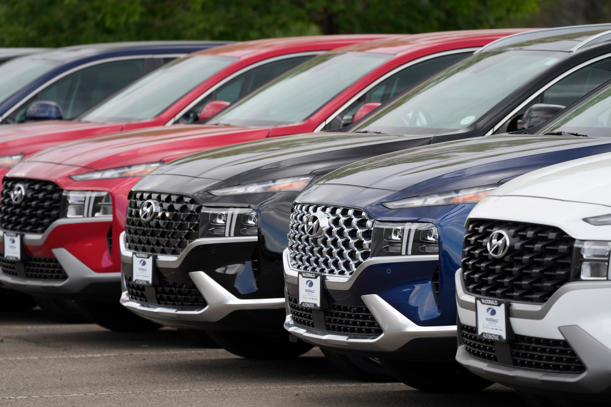 A line of 2022 Santa Fe SUV's sit outside a Hyundai dealership on Sept. 12, 2021, in Littleton, Colo. 