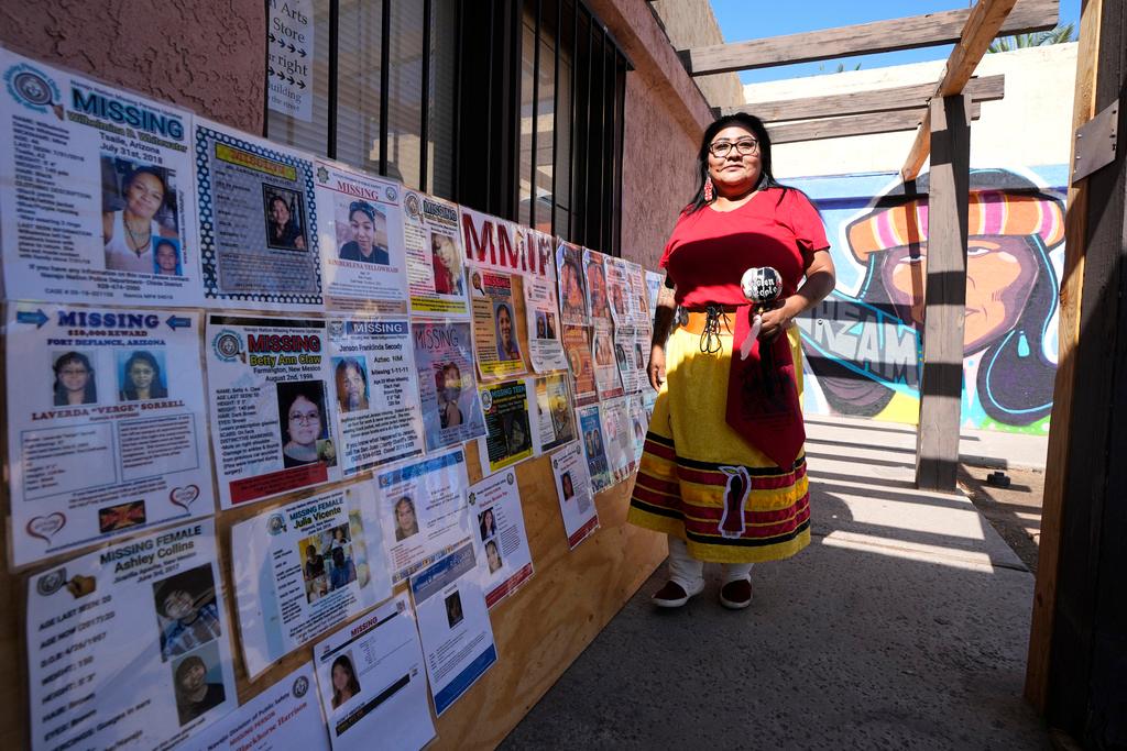 Grassroots advocate Reva Stewart walks outside the headquarters at Drumbeat Indian Arts, Monday, July 31, 2023, in Phoenix.