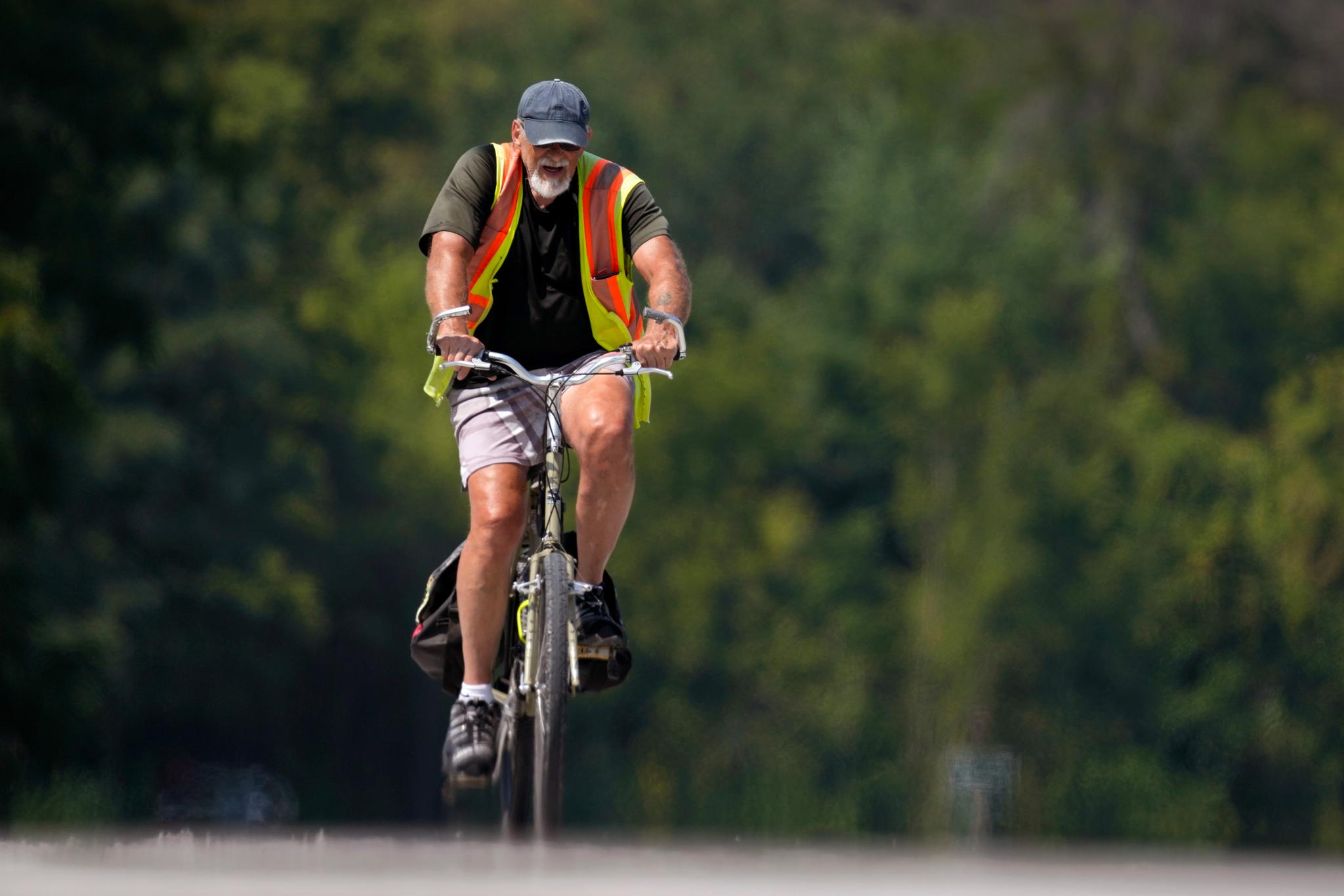 Man on bike wearing a safety vest
