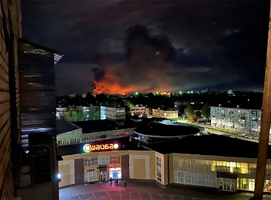 Smoke billowing over the city and a large blaze in Pskov, Russia
